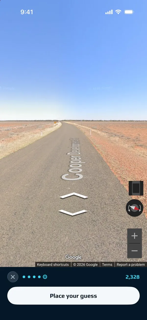 A Street View round: a long straight road across red desert, with a Place your guess button below.